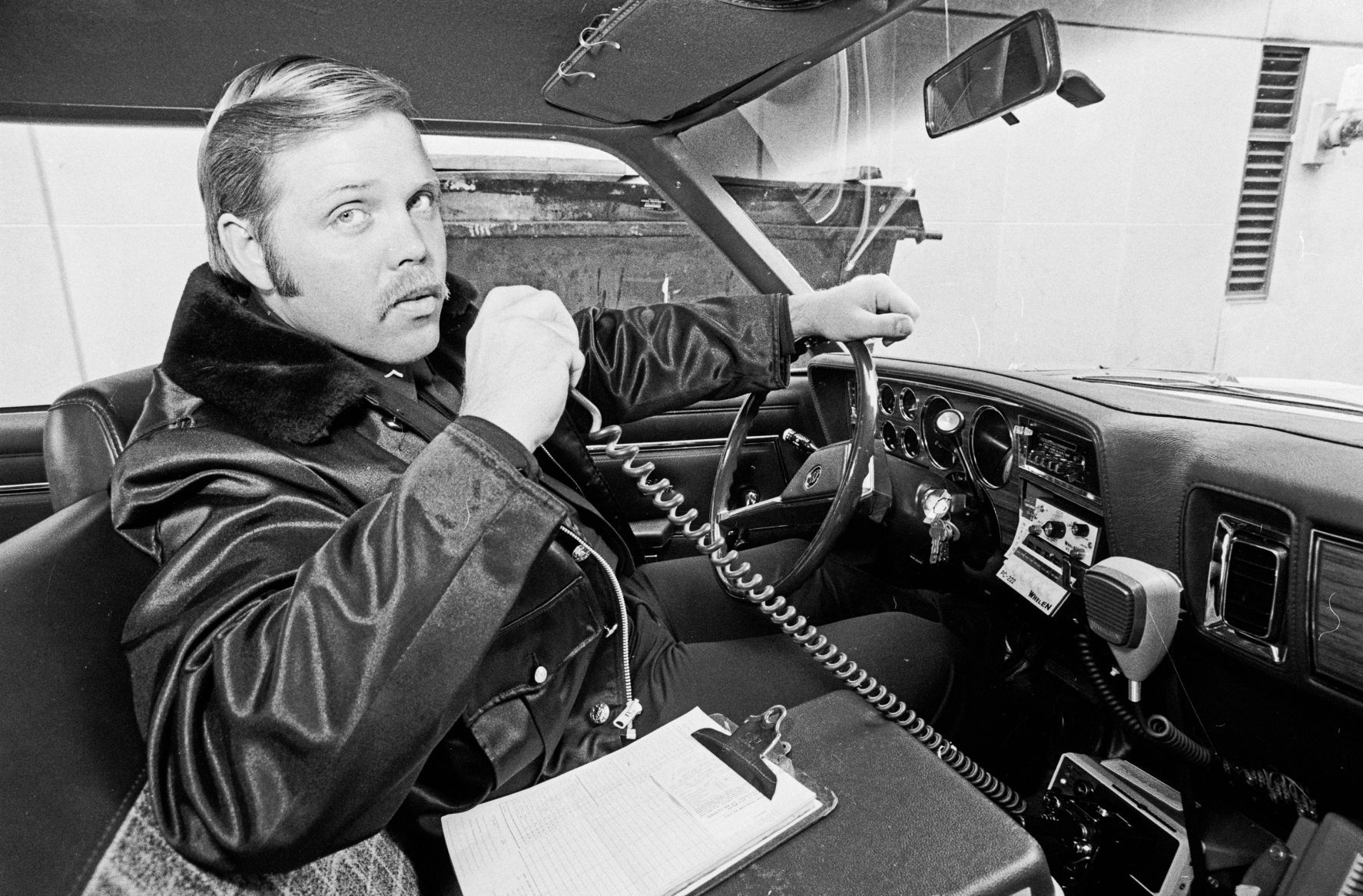 Billings police officer in new patrol car, April 1982